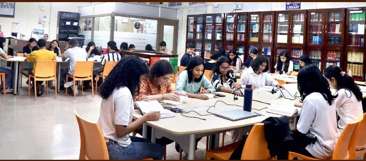Students working in the DNLU library